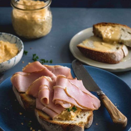 Crusty bread topped with split pease pudding and roasted ham.