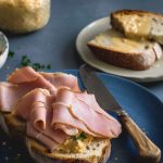 Crusty bread topped with split pease pudding and roasted ham.