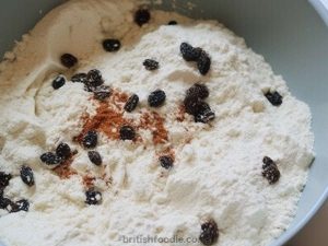 Welsh Cakes adding spices and raisins to the flour