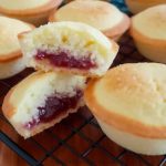 welsh cheese cakes with bottom pie crust and filled with raspberry jam and cake batter.