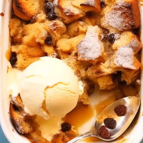 apricot sultanas bread and butter pudding in a baking pen topped with a scoop of vanilla ice cream