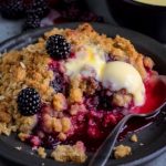 pear and blackberry crumble served with ice cream or custard