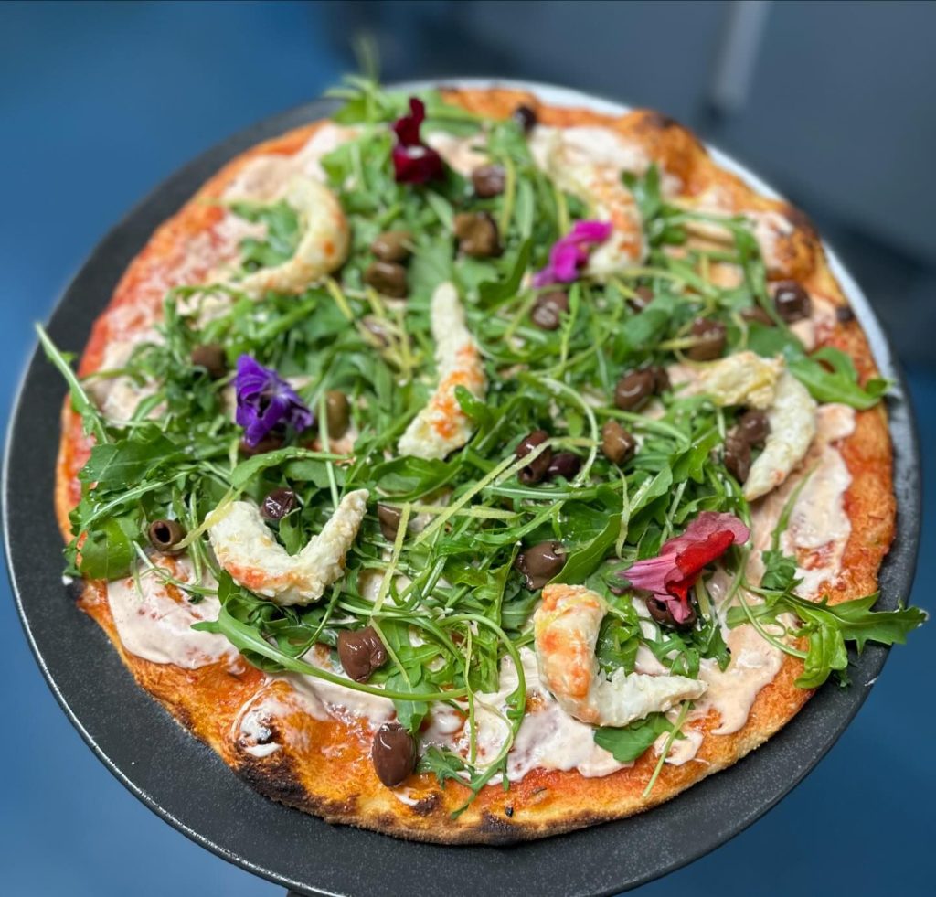 Vegan prawns, cocktail sauce, rocket salad and taggiasche olives.