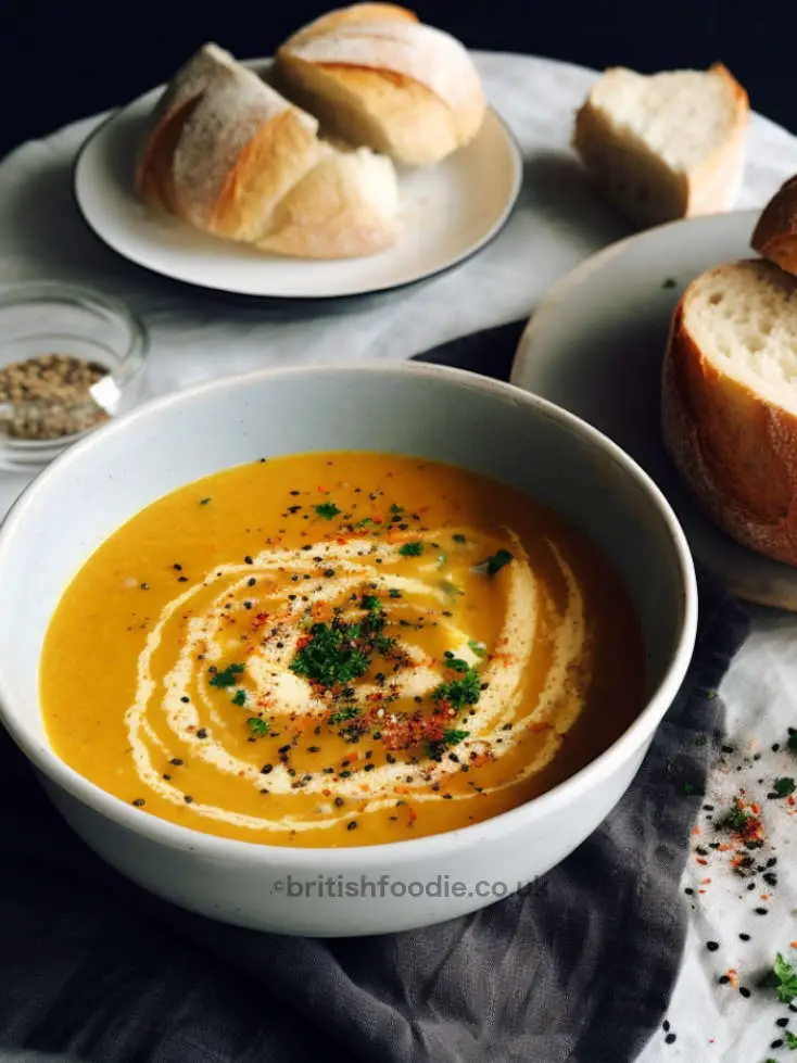 carrot and coriander soup with fresh coriander and paprika on top