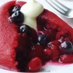 Slice of blackcurrant summer pudding