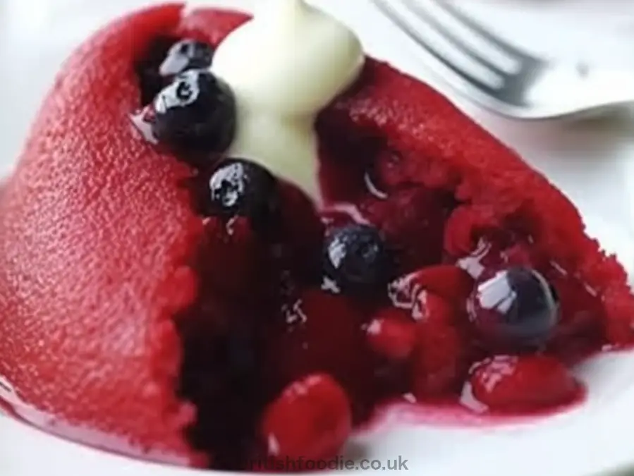 Slice of blackcurrant summer pudding